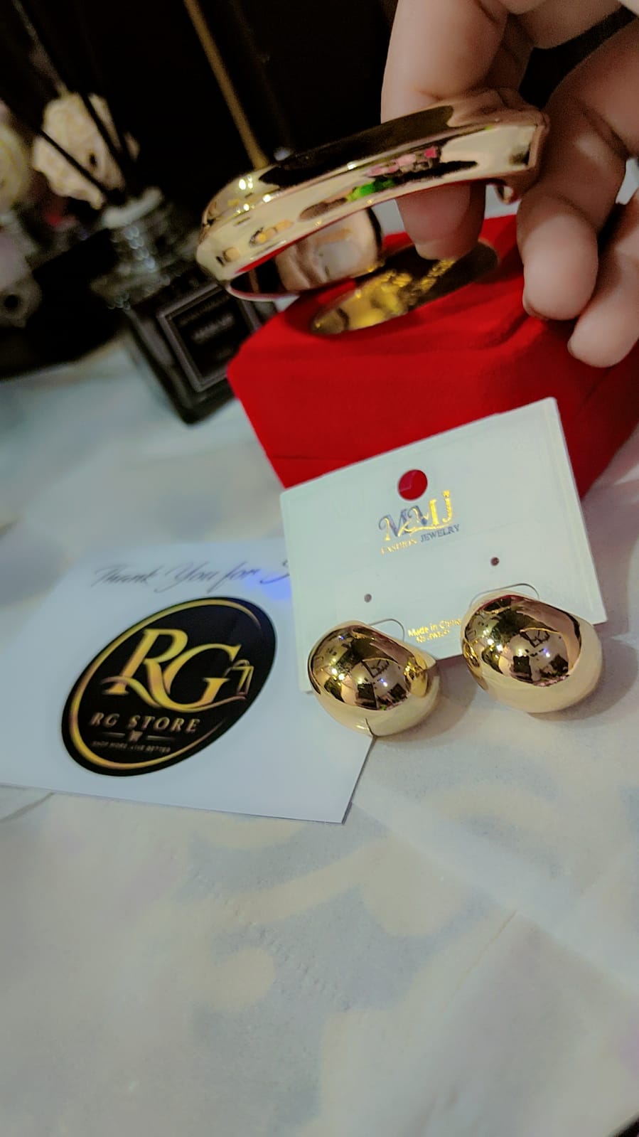 Golden statement bracelet and hoop earings