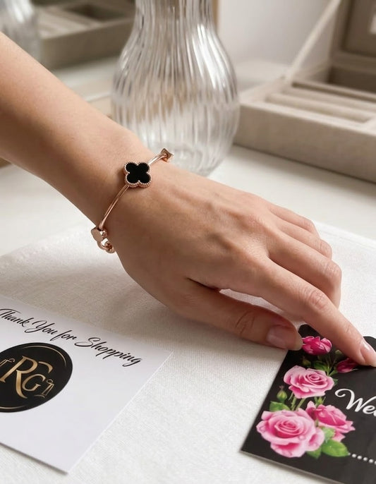 Elegant Black Clover Charm Bracelet – Golden Finish